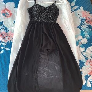 Cute Black romper with train and silver designs.